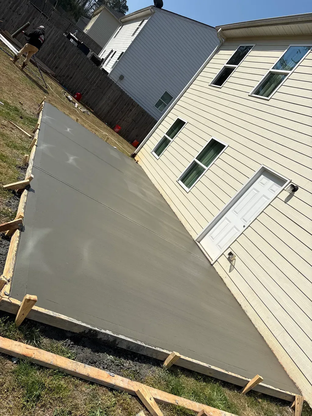 Freshly poured backyard slab still in the forms